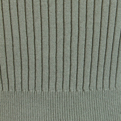 Detail of the ribbed knit texture on a long sleeve top