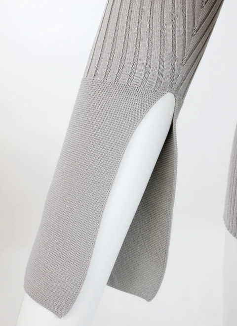 Detail shot of the Women's Delancey Wrap Sweater's sleeve split cuff on a white mannequin arm