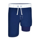 Front view of blue swim trunks with white trim for boys showing the blue liner