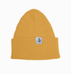 Yellow beanie with a brand label on a white background