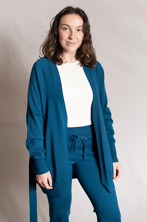 Woman wearing blue long sleeve sweater with matching jogger