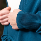 Closeup picture of blue sweater cuff