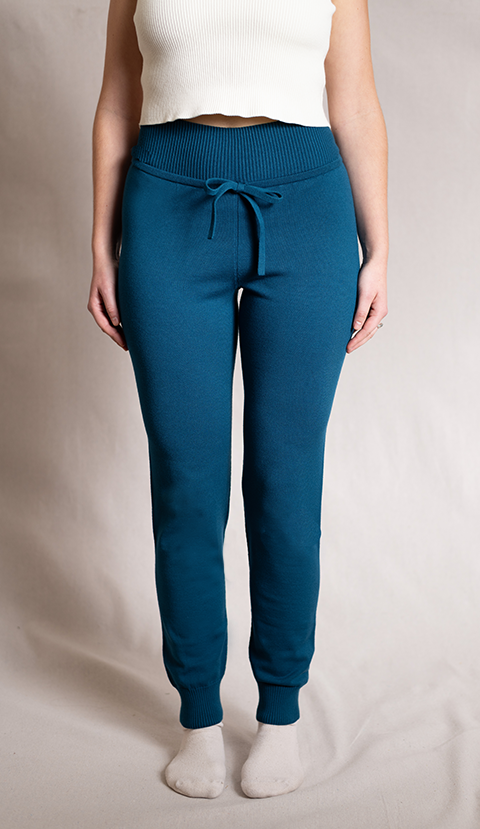 Waist down shot of woman wearing blue joggers