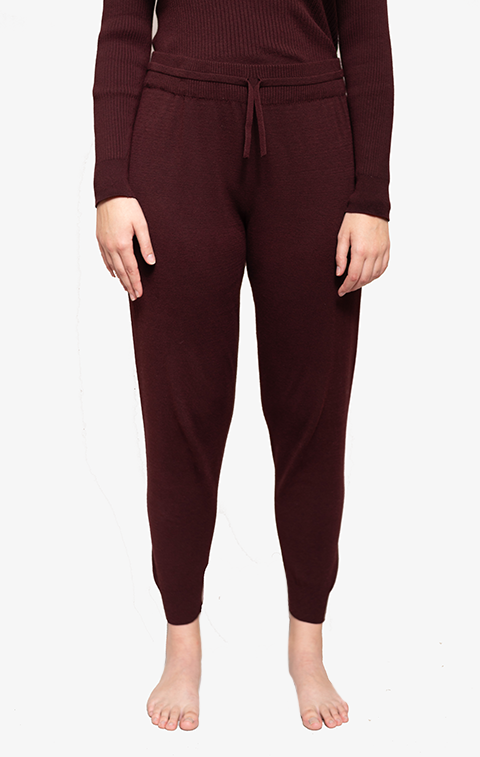 Waist down pic of women wearing maroon joggers