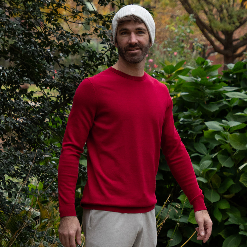 Man in a red sweater and tan beanie