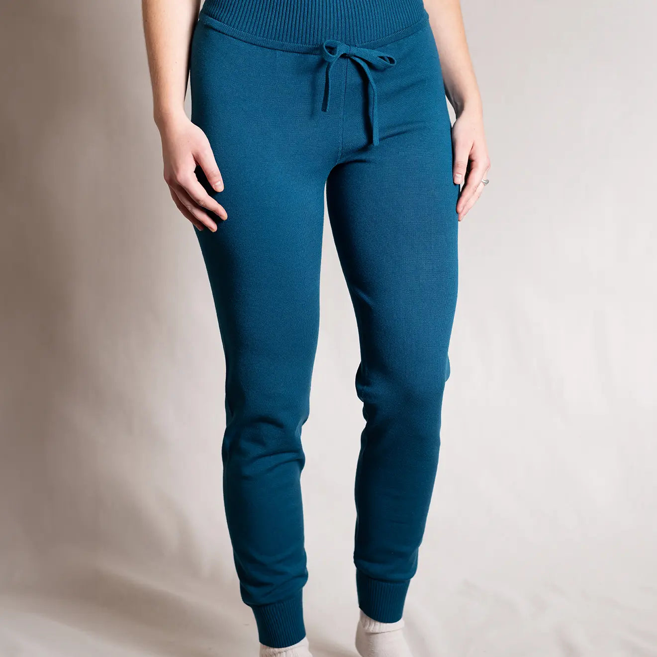 Women's Charlotte High-Waisted Jogger in peacock blue paired with white socks