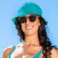 Woman wearing a turquoise sun hat, with shades and a matching turquoise bikini top