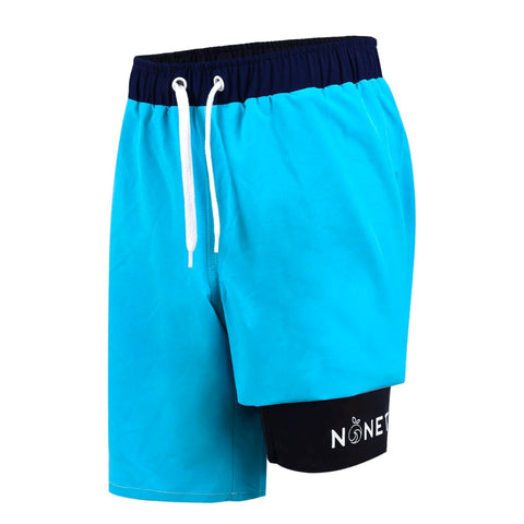Boys' Wave swim shorts in a blue and with black liner showing logo detail