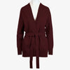 The Women's Callie Long Sleeve Front Tie Sweater in a rich burgundy color modeled on a white mannequin