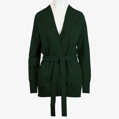 The Women's Callie Long Sleeve Front Tie Sweater presented in a green shade with belt tied at the waist on a white mannequin