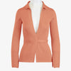 Front view of the Women's Delancey Wrap Sweater featured in a vibrant peach color