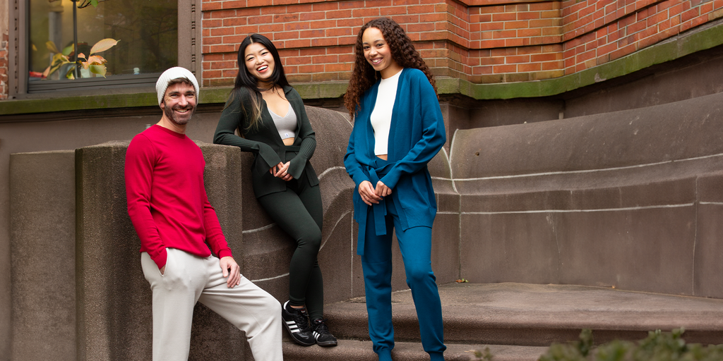 One man and two women standing on steps in NYC