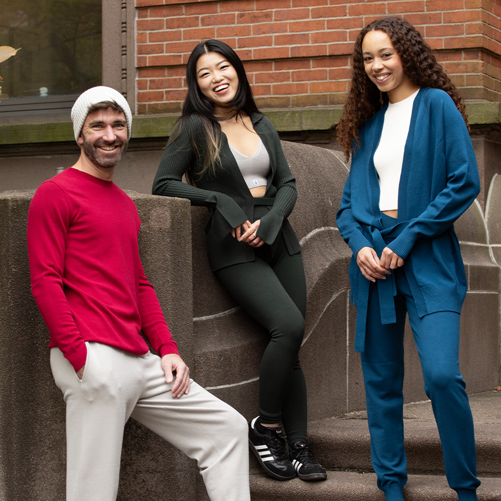 A man and two women standing on steps in NYC