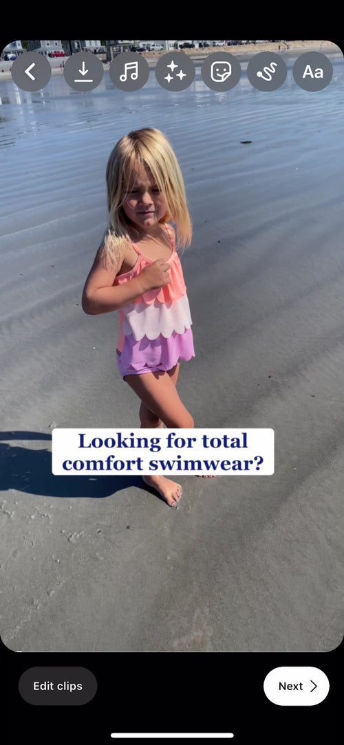 Video of two small girls wearing rashguards at the beach